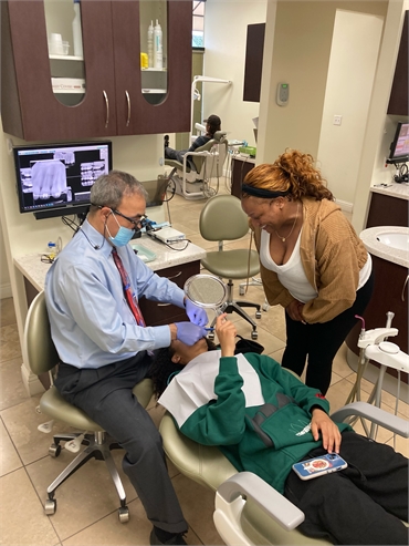 Concord dentist Dr. Haidari at work at Clayton Dental Group