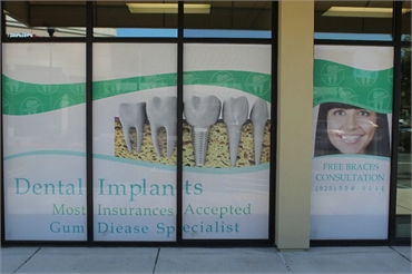 Signage on glass page at Concord dentist Clayton Dental Group