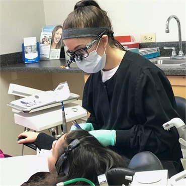 Dental hygienist at work at Sterling Dental