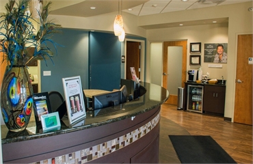 Front desk and refreshment bar at Milwaukee dentist Cigno Family Dental Greenfield WI