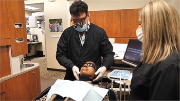 Milwaukee dentist Dr. Cigno at work with dental implants patient at Cigno Family Dental