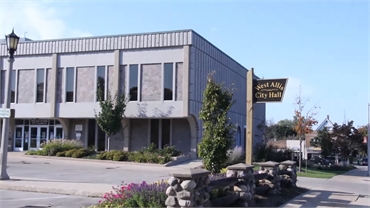 West Allis City Hall at 10 minutes drive to the north West Allis dentist Cigno Family Dental