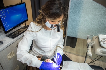 Chula Vista orthodontist Dr. Myriam Falcom at work with ClearCorrect patient at Perfect Smiles Calif
