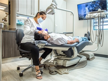 Chula Vista orthodontist Dr. Myriam Falcon examining patient at Perfect Smiles California