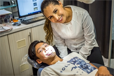 Chula Vista orthodontist Dr. Myriam Falcon with her happy Fastbraces patient at Perfect Smiles Calif