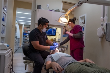 Toronto dentist Dr. Reyes using latest technology for a dental procedure at North Shores Dental