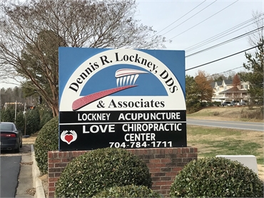 Signboard outside the office of Dennis R. Lockney DDS dentist in Concord NC
