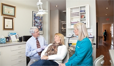 Wilmington dentist Dr. James Gainer with dental implants patient at Wrightsville Dental