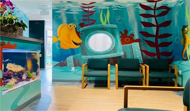 Large aquarium and sea life themed reception area at Danville orthodontist Diana T. Rose DDS MS