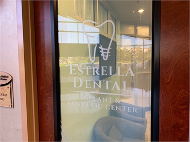 Signage on front door at Chula Vista dentist office  Estrella Dental