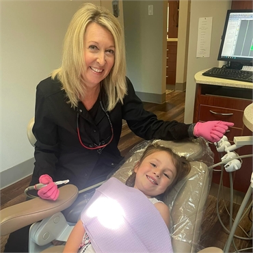 Teeth cleaning pediatric patient at Bryant dentist Ouellette Family Dentistry