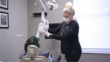 Dental hygienist taking X-ray for root canal at Meyer Cosmetic and General Dentistry