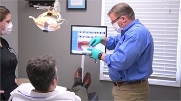 Greenville dentist Dr. James Meyer explaining dental crown at Meyer Cosmetic and General Dentistry