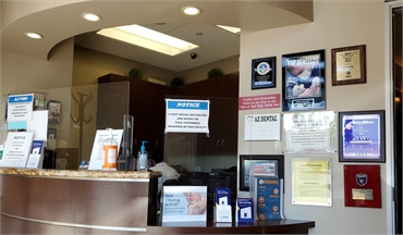 Reception center and awards display at AZ Dental - San Jose