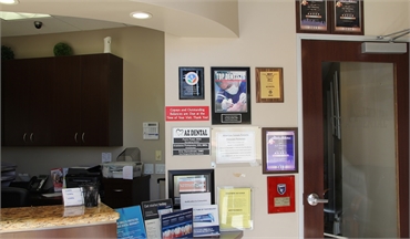 Awards display and entrance to waiting area at AZ Dental - San Jose