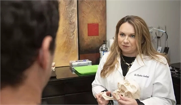 Jonesboro dentist Dr. Heather Southard explaining treatment options to patient at Southard Family De