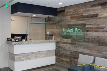 Plexiglass installed at the reception area at Weymouth dentist South Shore Dentistry