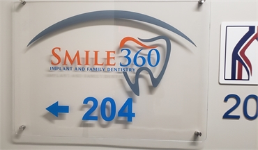 Signage at the office entrance at Smile 360 Implant and Family Dentistry Riverview FL