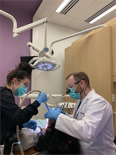 Dr. McQueen performing root canal at McQueen Dental