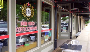 Iron Horse Coffee Company at 27 minutes to the north of Rogers dentist McQueen Dental