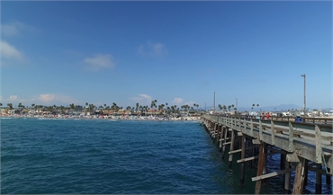 Newport Beach Pier at 22 minutes drive to the west of Lake Forest CA dentist Pankaj R. Narkhede  DDS