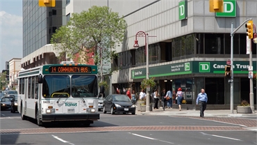 Durham Regional Transit bus passing TD Canada Trust Branch and ATM on King St W at 5 minutes drive t