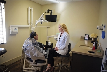 Dr. Hagerman explaining cosmetic dentistry options to patient at Litchfiled Park dentist Warren and 