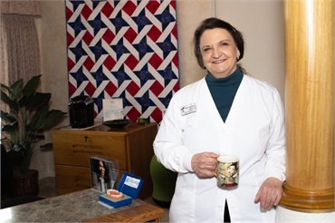 Dr. Virginia McMillan standing at front desk at John Day Smiles  