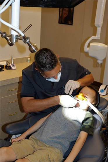 Tempe dentist Dr. Sobieraj working on child patient
