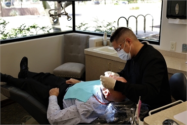 Tempe dentist Dr. Sobieraj working on dentures procedure at Beautiful Dentistry