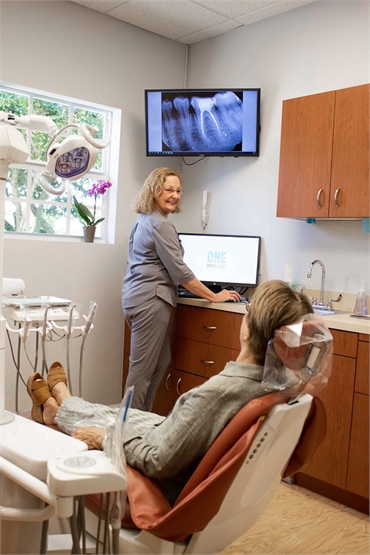 Dental assistant with patient at Davie FL dentist One Dental Studio