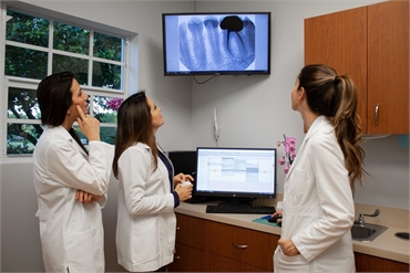 Davie dentists discussing a case at One Dental Studio