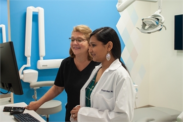 Freehold Township dentist Dr. Prachi Shah planning cosmetic dentistry procedure with dental assistan