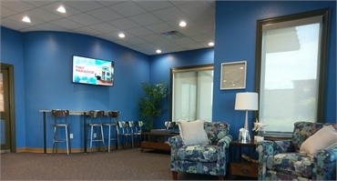 Waiting area and patient desk at Sealy Orthodontics