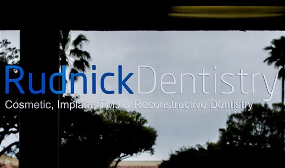 Window Sign of implant dentist Palm Beach Gardens  FL Andrew Rudnick DMD