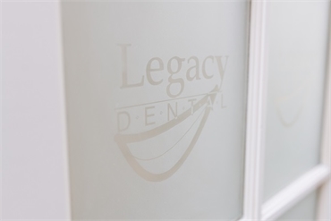 Signage on the glasspane at Salt Lake City emergency dentistry Legacy Dental