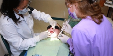 Dr. Josephine Lee performing tooth colored fillings at Federal Way dentist Avalon Family Dentistry