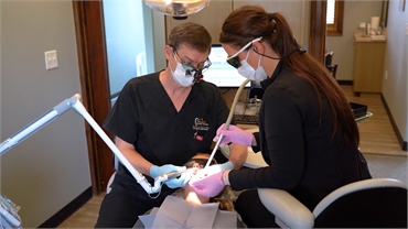 Dr. Wesley Zboril perrforming root canal procedure at Sealy Dental Center