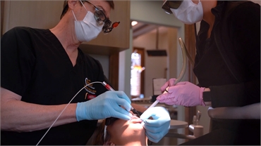 Dr Wesley Zboril performing endodontic treatment at Sealy Dental Center