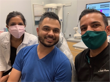 Gilbert dentist Dr. Sahil Arora and orthodontist Dr. Shana Vora with Invisalign patient at Oasis Fam