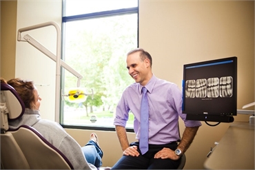 Beaverton OR Dentist Dr. Bruno da Costa working with patient at Harmony Dental