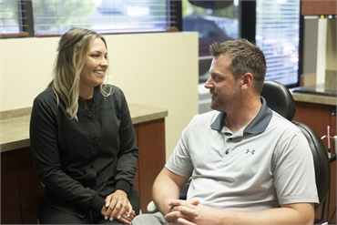 Spokane dentist Dr McDonald explaining dental implant options to patient