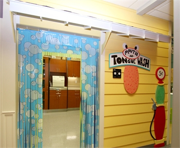 Gas station themed entrance at Austin pediatric dentists and orthodontists Smiles of Austin