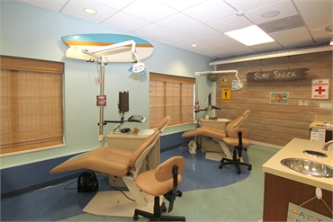 Surf shack themed open bay operatory at Austin pediatric dentists and orthodontists Smiles of Austin
