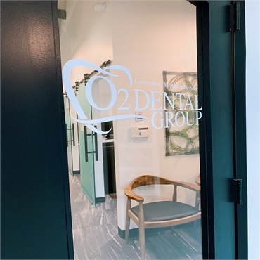 Signage on glass panel on the entrance door at O2 Dental Group of Southern Pines