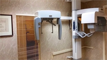 Dental X-ray machine at A Caring Dental Group