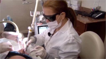 Cosmetic dentist Dr. Rozenberg performs Nightlase procedure in her office in NY 10065