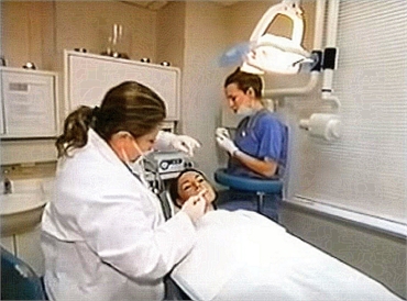 Dr Lana Rozenberg performs a dental veneers procedure at her cosmetic dentistry in NY